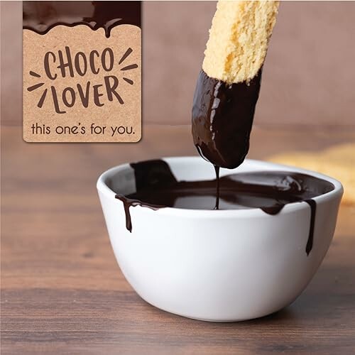 Biscuit being dipped into chocolate sauce with 'Choco Lover' sign.