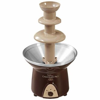 Chocolate fountain appliance with brown base and metal tiers.