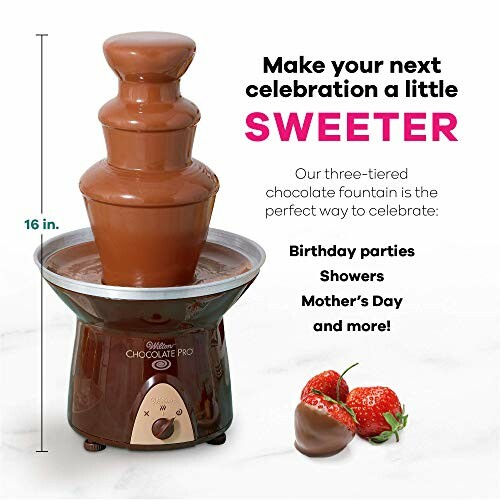 Three-tiered chocolate fountain with strawberries.